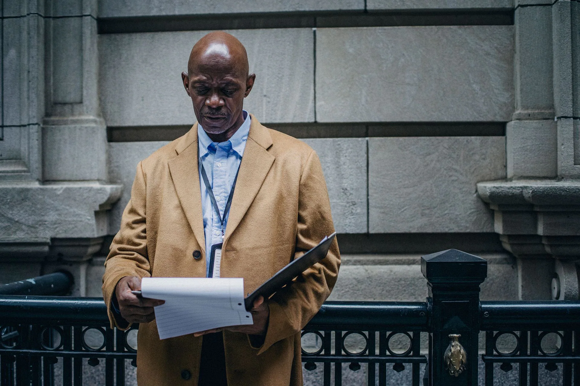 Black legal professional carefully reviewing documents